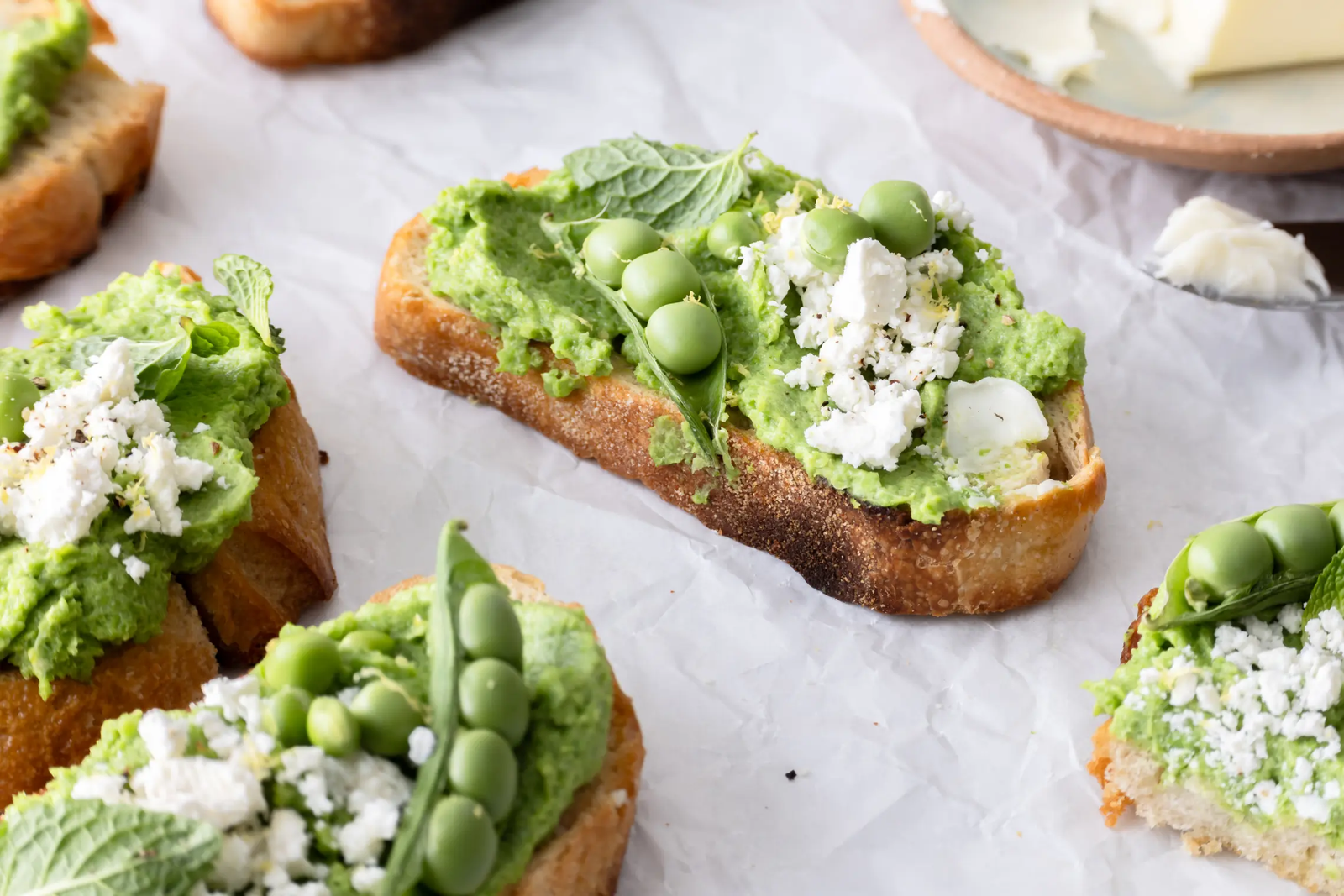 Whipped Feta and Spring Pea Crostini with Mint and Lemon